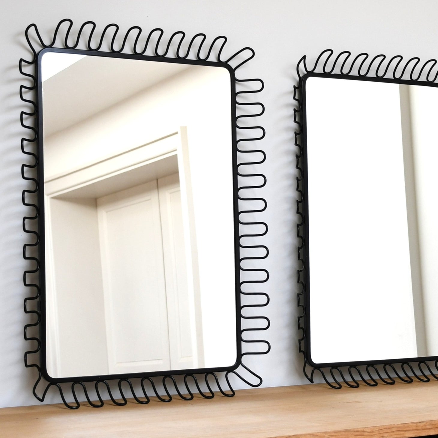 A Pair of Francis Cayouette - Wall Mirrors
